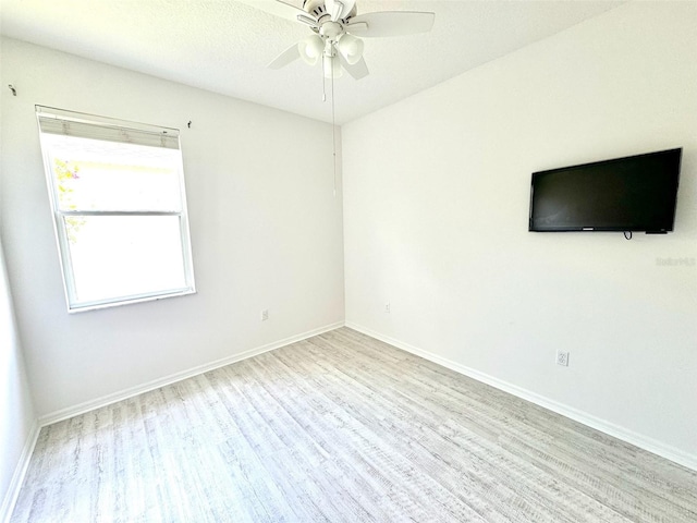14315 Tree Swallow Way, Lakewood Ranch, FL 34202 - empty room featuring wood finished floors, ceiling fan, and baseboards