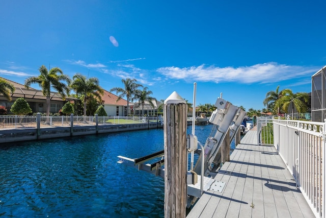 569 Mast Dr, Bradenton, FL 34208 - dock area featuring boat lift and a water view