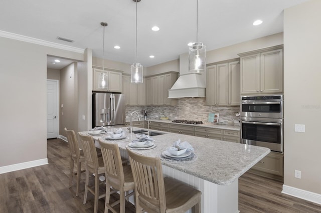 569 Mast Dr, Bradenton, FL 34208 - kitchen with appliances with stainless steel finishes, custom exhaust hood, a sink, dark wood-style floors, and baseboards