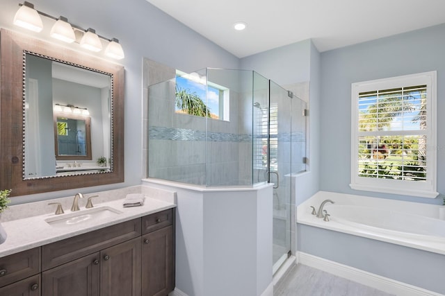 569 Mast Dr, Bradenton, FL 34208 - bathroom with vanity, a shower stall, and a bath