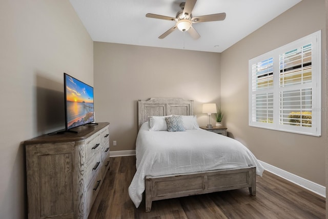 569 Mast Dr, Bradenton, FL 34208 - bedroom with baseboards, dark wood-style floors, and a ceiling fan