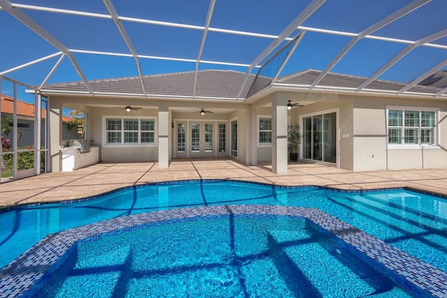 569 Mast Dr, Bradenton, FL 34208 - view of pool with ceiling fan, a pool with connected hot tub, a lanai, and a patio
