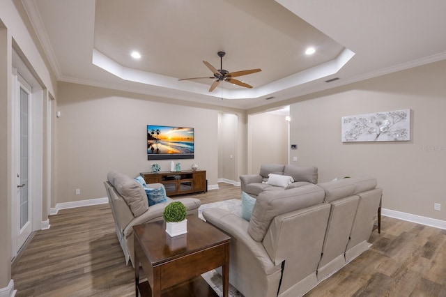 569 Mast Dr, Bradenton, FL 34208 - living area with a raised ceiling, a ceiling fan, wood finished floors, recessed lighting, and baseboards