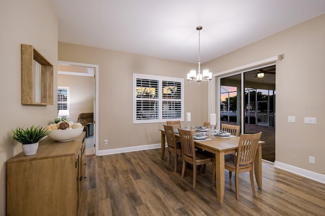 569 Mast Dr, Bradenton, FL 34208 - dining space with dark wood-style floors, baseboards, and a chandelier