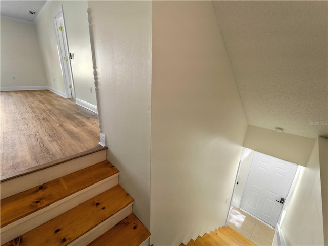3405 10th St W, Palmetto, FL 34221 - stairs featuring visible vents, wood finished floors, and baseboards