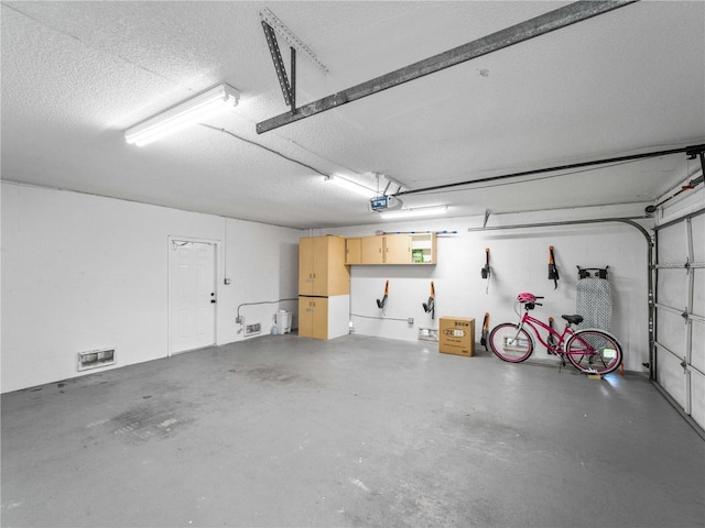 3405 10th St W, Palmetto, FL 34221 - garage featuring visible vents and a garage door opener