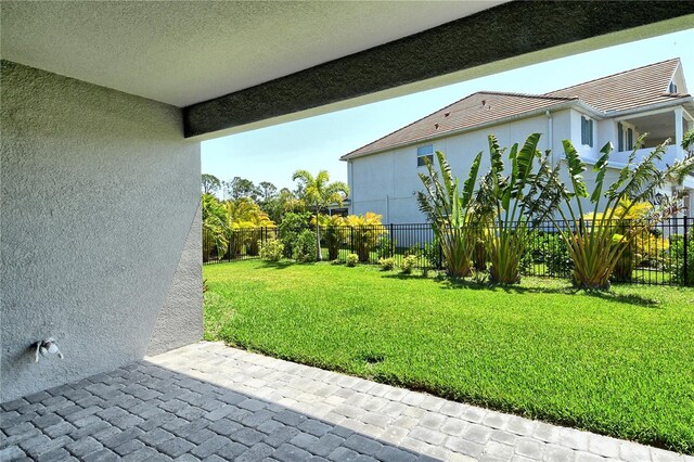 view of yard with a fenced backyard and a patio area