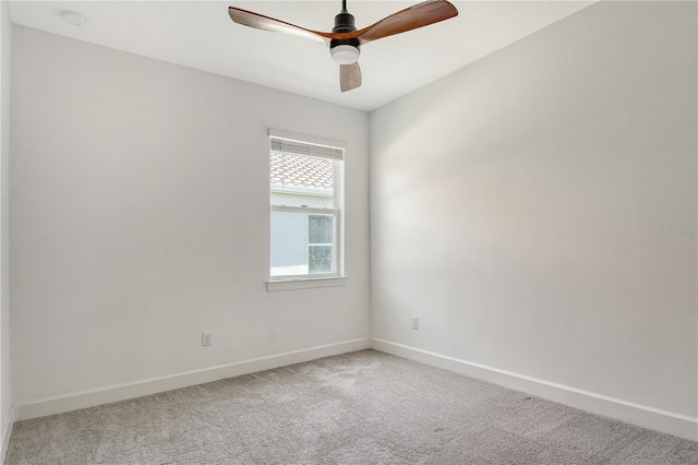 unfurnished room with baseboards, carpet flooring, and ceiling fan