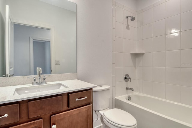 bathroom featuring vanity, bathing tub / shower combination, and toilet