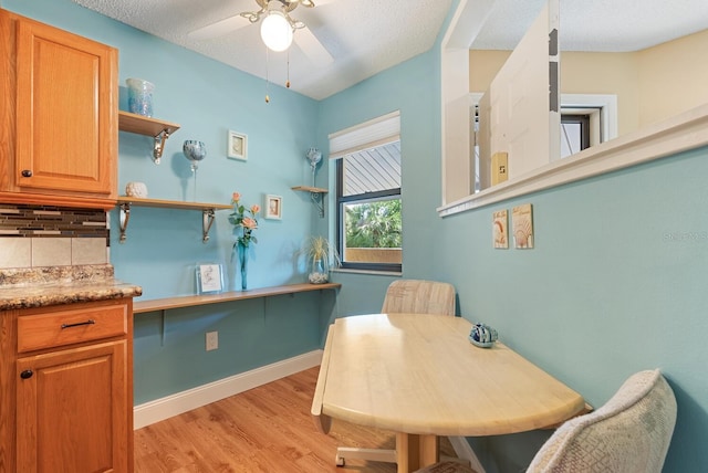 5736 Ashton Lake Dr, Sarasota, FL 34231 - dining space featuring ceiling fan, light wood finished floors, and baseboards