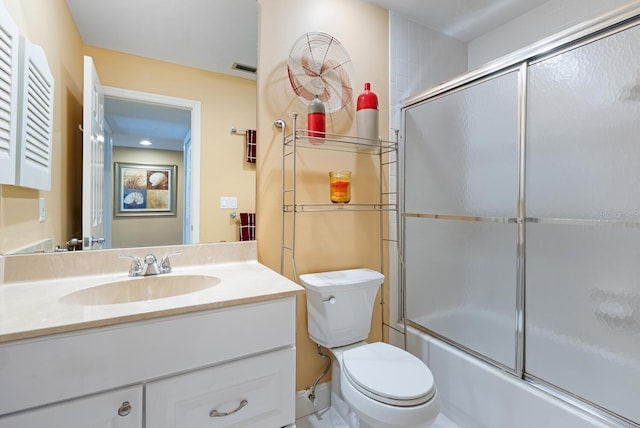 5736 Ashton Lake Dr, Sarasota, FL 34231 - bathroom with toilet, bath / shower combo with glass door, and vanity
