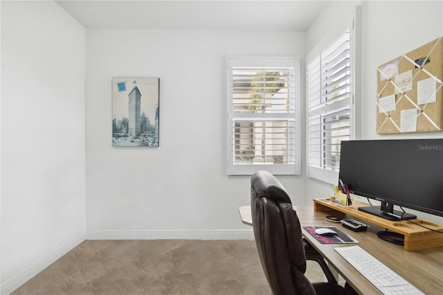 home office with baseboards and carpet