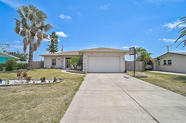 1789 Elm Dr, Venice, FL 34293 - single story home with a front lawn, an attached garage, driveway, stucco siding, and fence