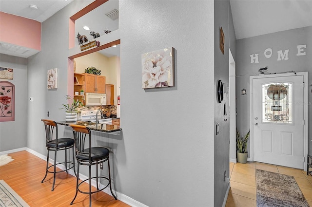 1789 Elm Dr, Venice, FL 34293 - foyer entrance featuring light tile patterned floors, visible vents, and baseboards