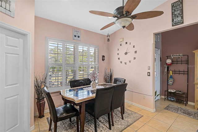 1789 Elm Dr, Venice, FL 34293 - dining area featuring light tile patterned floors, a ceiling fan, and baseboards