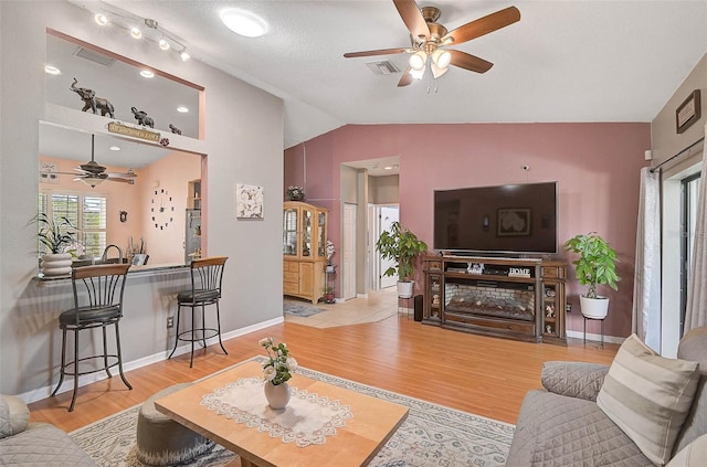 1789 Elm Dr, Venice, FL 34293 - living area with visible vents, wood finished floors, ceiling fan, and lofted ceiling