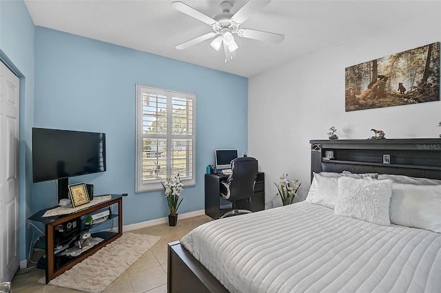 1789 Elm Dr, Venice, FL 34293 - bedroom featuring light tile patterned floors, ceiling fan, and baseboards