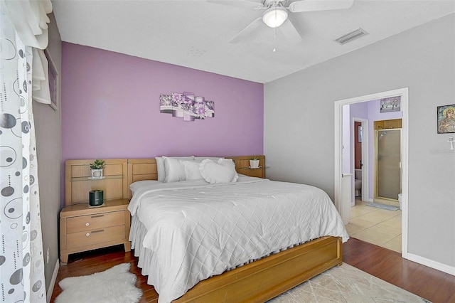 1789 Elm Dr, Venice, FL 34293 - bedroom with visible vents, wood finished floors, ceiling fan, and connected bathroom