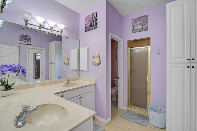 1789 Elm Dr, Venice, FL 34293 - bathroom featuring a shower stall, vanity, toilet, baseboards, and tile patterned flooring