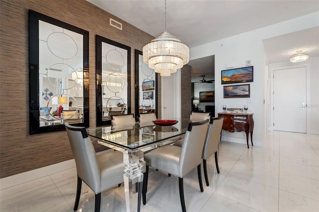 111 S Pineapple Ave Unit 716, Sarasota, FL 34236 - dining room with visible vents, marble finish floor, ceiling fan with notable chandelier, and baseboards