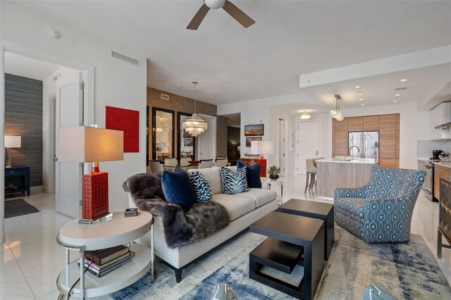 111 S Pineapple Ave Unit 716, Sarasota, FL 34236 - living room featuring visible vents and ceiling fan with notable chandelier