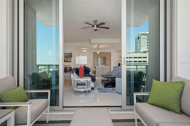 111 S Pineapple Ave Unit 716, Sarasota, FL 34236 - tiled living area with ceiling fan and a healthy amount of sunlight