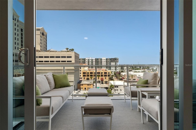 111 S Pineapple Ave Unit 716, Sarasota, FL 34236 - balcony featuring a city view and an outdoor living space