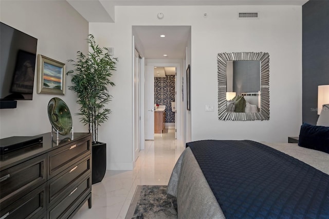 111 S Pineapple Ave Unit 716, Sarasota, FL 34236 - bedroom featuring recessed lighting, marble finish floor, connected bathroom, and visible vents