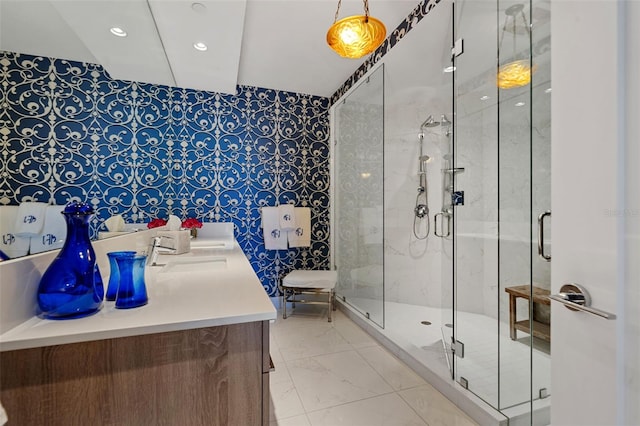 111 S Pineapple Ave Unit 716, Sarasota, FL 34236 - full bathroom with vanity, marble finish floor, recessed lighting, wallpapered walls, and a stall shower