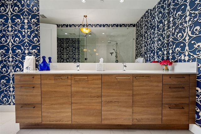 111 S Pineapple Ave Unit 716, Sarasota, FL 34236 - full bath with a sink, tile patterned flooring, double vanity, visible vents, and a stall shower