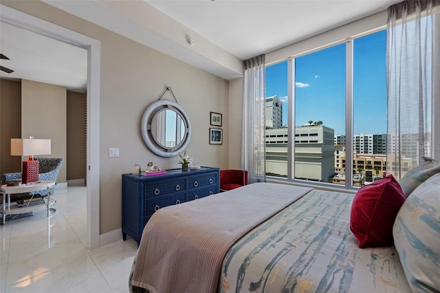 111 S Pineapple Ave Unit 716, Sarasota, FL 34236 - bedroom with baseboards and marble finish floor