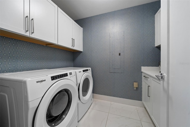 111 S Pineapple Ave Unit 716, Sarasota, FL 34236 - washroom featuring baseboards, marble finish floor, cabinet space, and washing machine and dryer