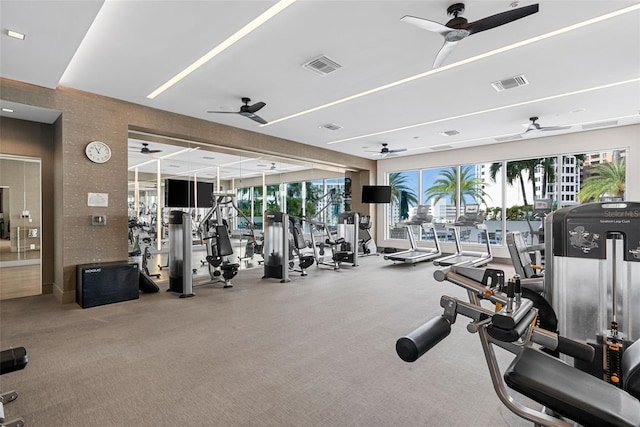 111 S Pineapple Ave Unit 716, Sarasota, FL 34236 - exercise room with visible vents, a ceiling fan, and carpet floors