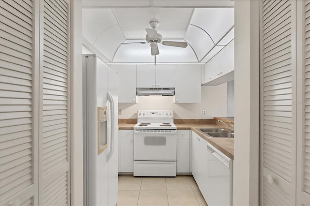 752 White Pine Tree Rd Unit 101, Venice, FL 34285 - kitchen with a sink, under cabinet range hood, light tile patterned flooring, white appliances, and white cabinets