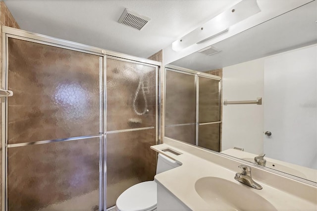752 White Pine Tree Rd Unit 101, Venice, FL 34285 - bathroom with toilet, a stall shower, visible vents, and vanity