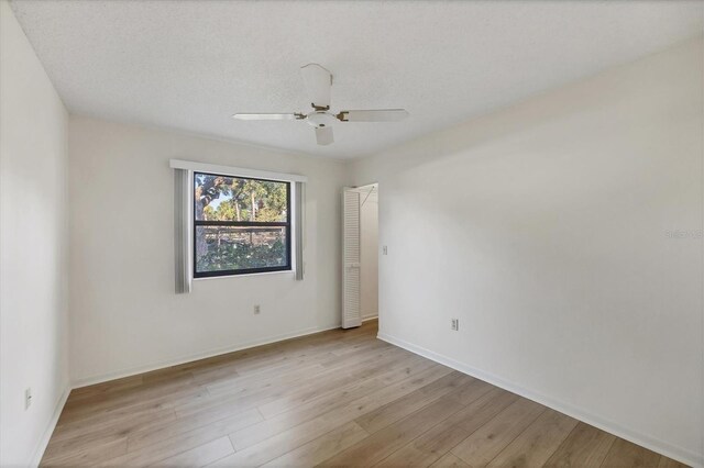 752 White Pine Tree Rd Unit 101, Venice, FL 34285 - empty room featuring ceiling fan, light wood-style flooring, and baseboards