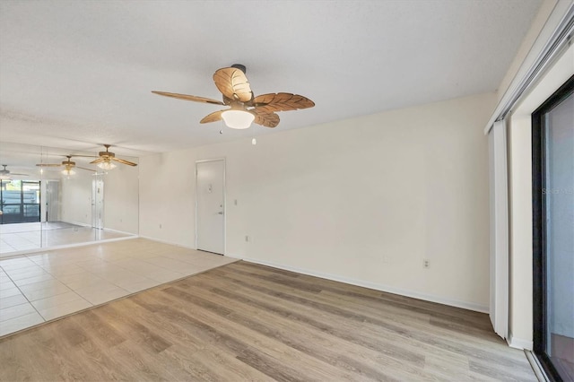 752 White Pine Tree Rd Unit 101, Venice, FL 34285 - interior space with a ceiling fan, baseboards, and light wood-type flooring