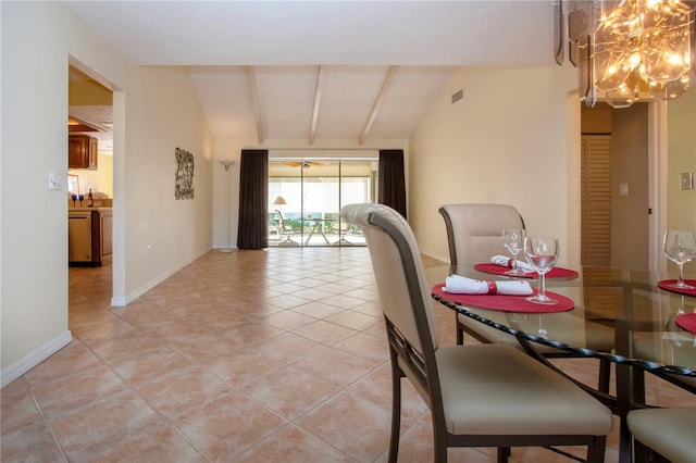 3843 El Poinier Ct W Unit 8720, Sarasota, FL 34232 - dining space with vaulted ceiling, a chandelier, light tile patterned floors, and baseboards