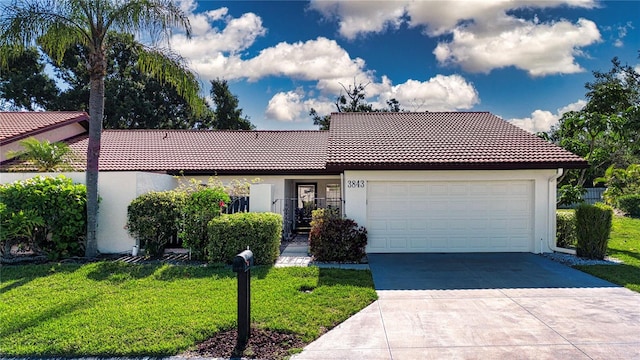 3843 El Poinier Ct W Unit 8720, Sarasota, FL 34232 - view of front facade with a tile roof, stucco siding, a garage, and a front yard