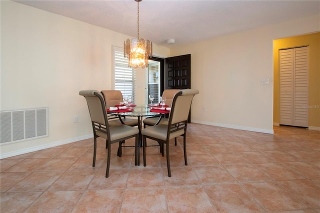 3843 El Poinier Ct W Unit 8720, Sarasota, FL 34232 - dining space with a chandelier, tile patterned floors, and baseboards