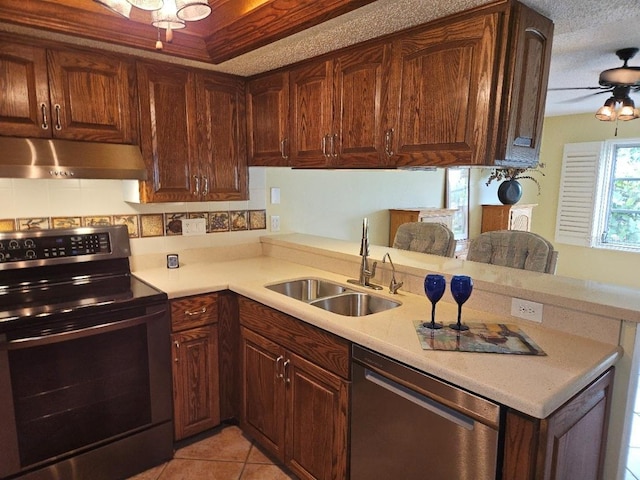 3843 El Poinier Ct W Unit 8720, Sarasota, FL 34232 - kitchen featuring under cabinet range hood, electric stove, stainless steel dishwasher, a sink, and a ceiling fan