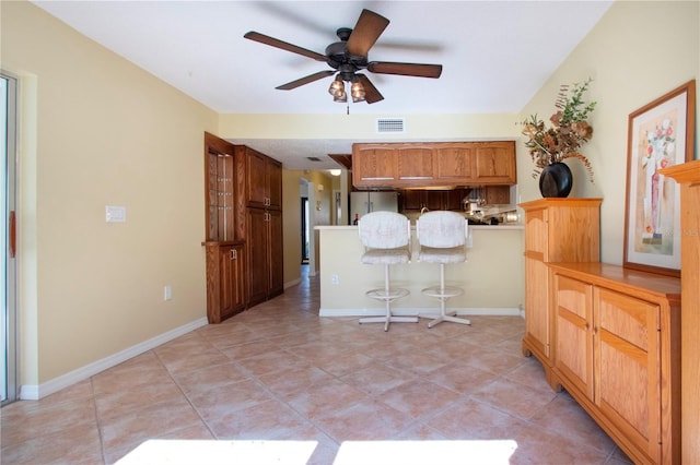 3843 El Poinier Ct W Unit 8720, Sarasota, FL 34232 - kitchen featuring freestanding refrigerator, a ceiling fan, light tile patterned floors, and baseboards
