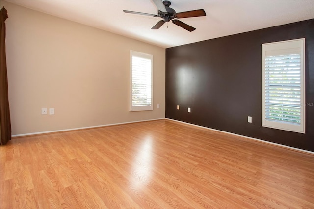 3843 El Poinier Ct W Unit 8720, Sarasota, FL 34232 - empty room featuring ceiling fan, light wood-style flooring, and baseboards