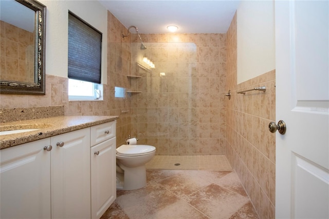 3843 El Poinier Ct W Unit 8720, Sarasota, FL 34232 - bathroom with tile walls, tiled shower, vanity, and toilet
