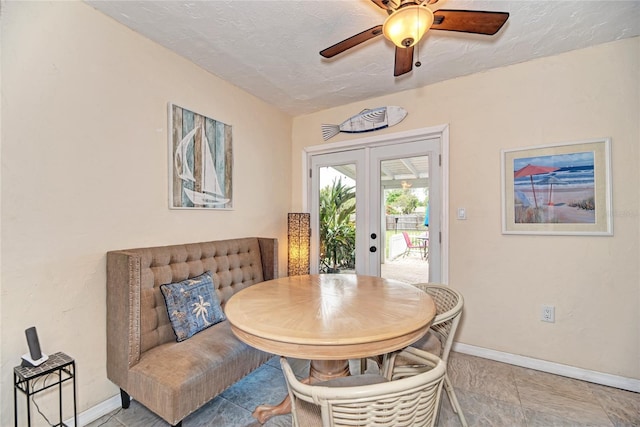 dining area featuring ceiling fan, french doors, and baseboards