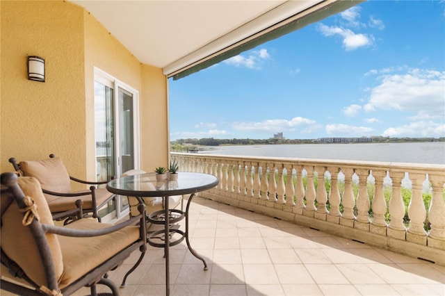 balcony featuring a water view