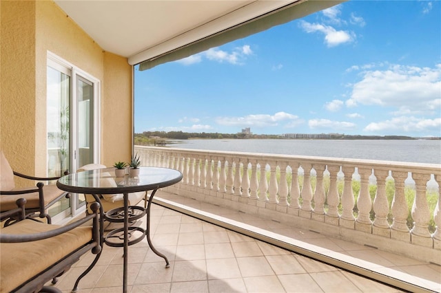 balcony featuring a water view