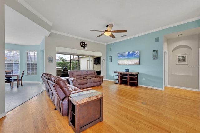 5106 Far Oak Cir, Sarasota, FL 34238 - living area featuring visible vents, ornamental molding, baseboards, ceiling fan, and light wood finished floors