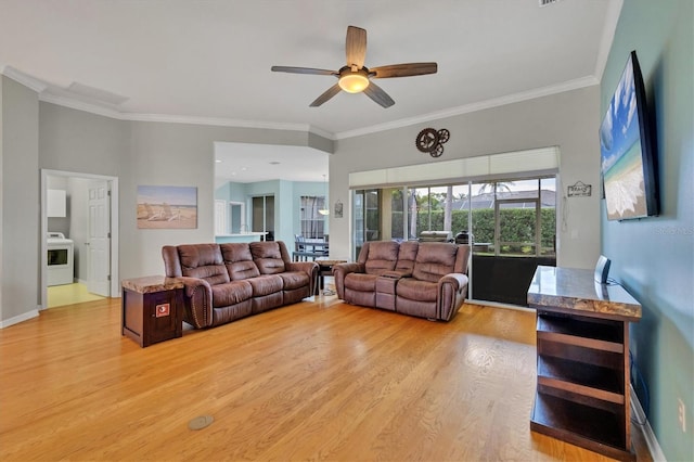 5106 Far Oak Cir, Sarasota, FL 34238 - living area with washer / dryer, ceiling fan, ornamental molding, and light wood-type flooring