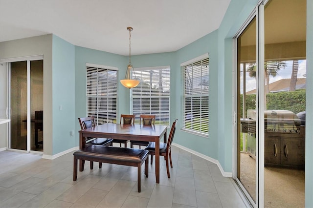 5106 Far Oak Cir, Sarasota, FL 34238 - dining area featuring baseboards and light tile patterned flooring
